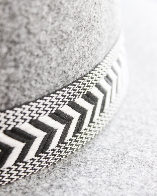 Heather grey boho fedora wide brim hat with black and white angled design strip wrapped around brim