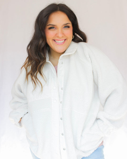 Fuzzy soft white button up jacket with two pockets and roll down collar