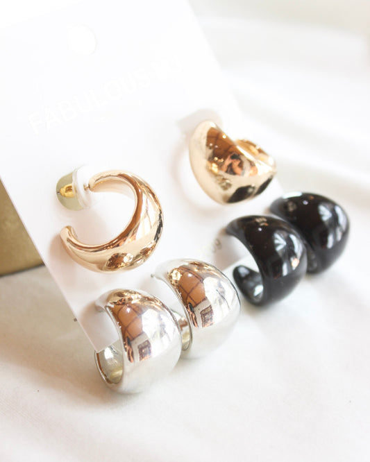 three earrings pack with a pair of gold, silver, and black chunky hoops