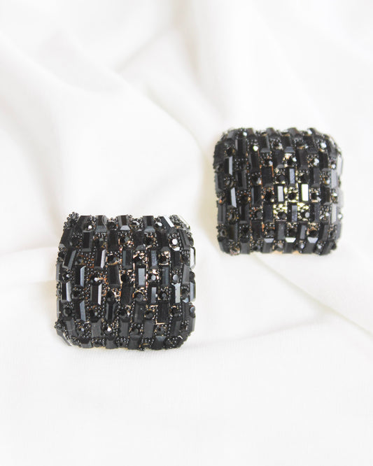 Square statement earrings with small black rectangle gems and gold accents
