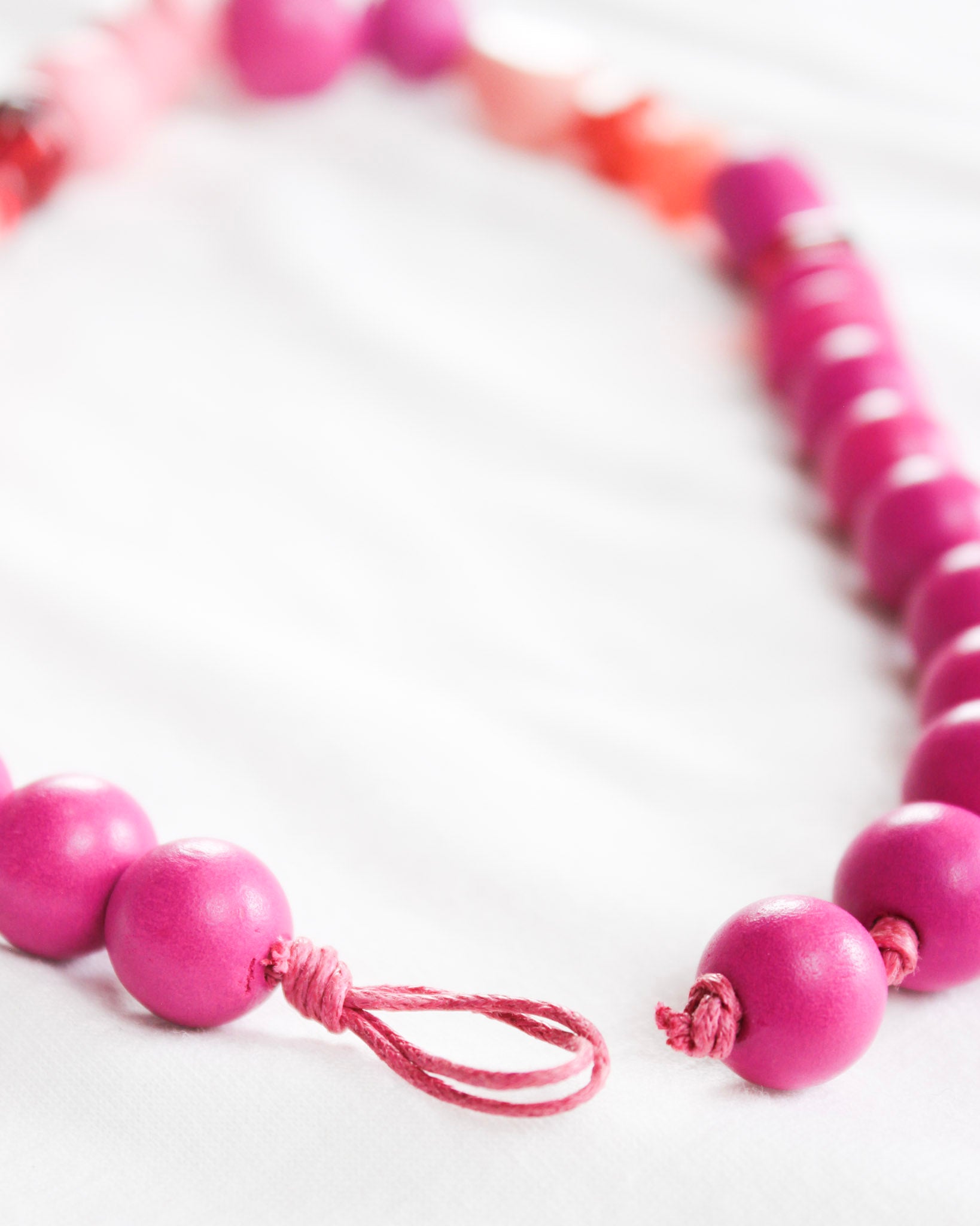 Bright pink and red mix beaded necklace with easy closure