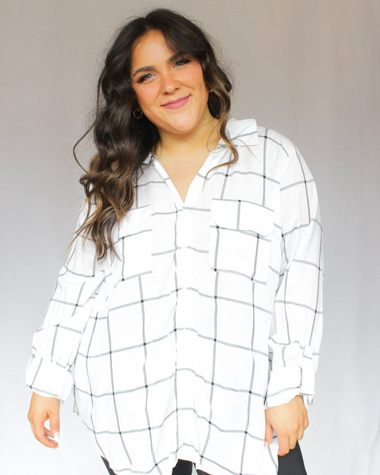 White with black stripes grid design, collared neckline, breathable sheer fabric, full length top with two chest pockets