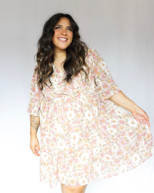 Muted earth pink orange cream and green aesthetic floral pattern mini dress with 3/4 sleeves v-neckline and flowy skirt