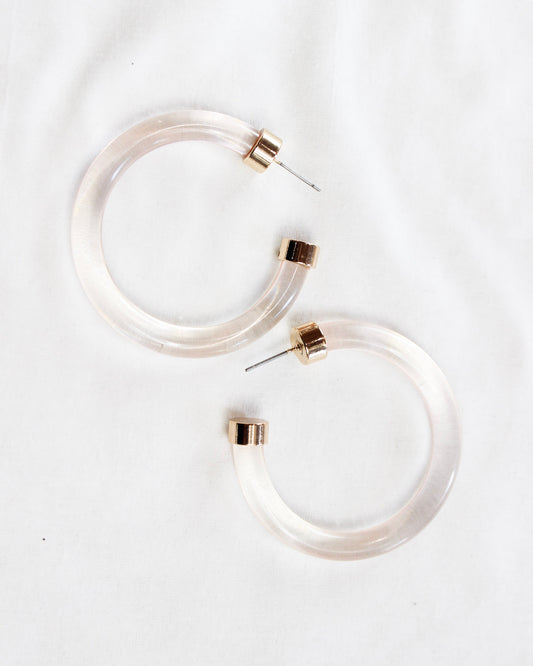 Translucent pink hoops with gold accents 