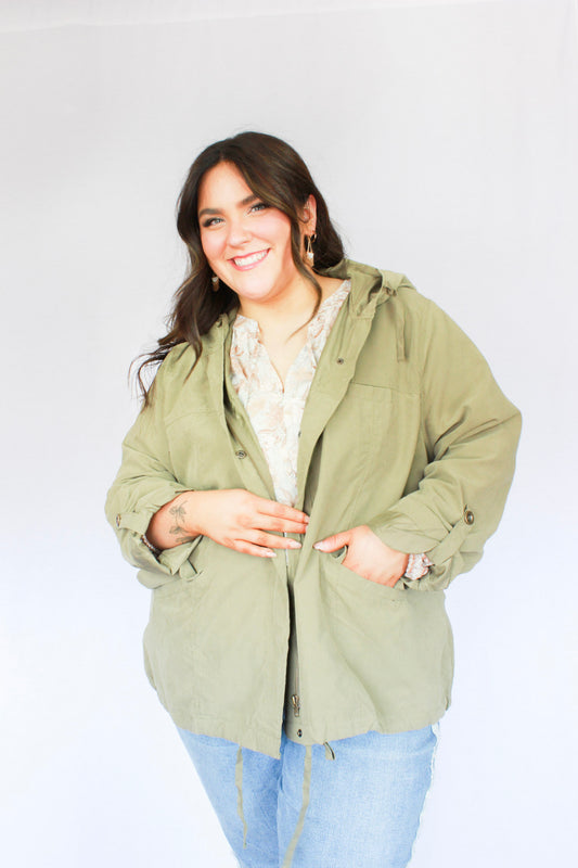 Army green zip up and button closure jacket with hoodie, two pockets, tieing strings for hood and bottom hem long length 