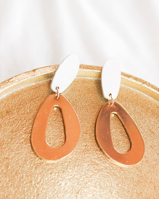 Dangle statement earrings with white oval into big gold imperfect oval 
