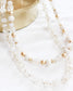 White assorted layered bead necklace with gold details and mini stars 