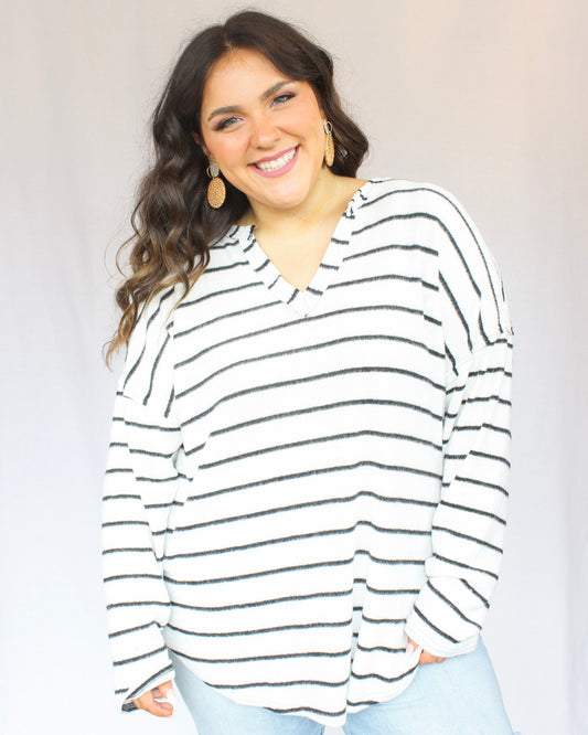 Soft white with black thin horizontal striped long sleeve top with v-neckline, full length 