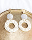 boho style statement earrings with gold accents and tortoise circle into a big wicker round circle 
