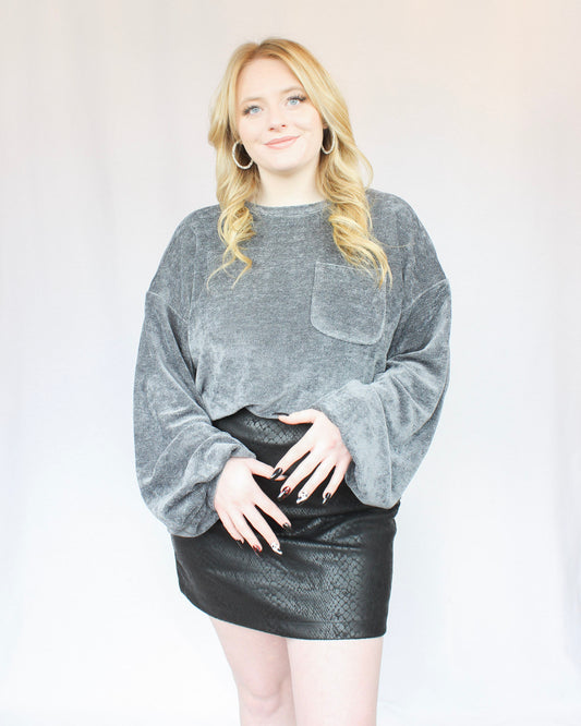 Dark grey heather soft casual sweater drop shoulder style with long balloon sleeves and a patch pocket on left side 