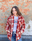 Red and white sherpa flannel jacket with tortoise buttons, two pockets on bottom, two pockets on chest with flaps 