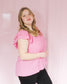 Bright pink blouse top with flutter sleeves and open back detail and tie on back with scoop neckline