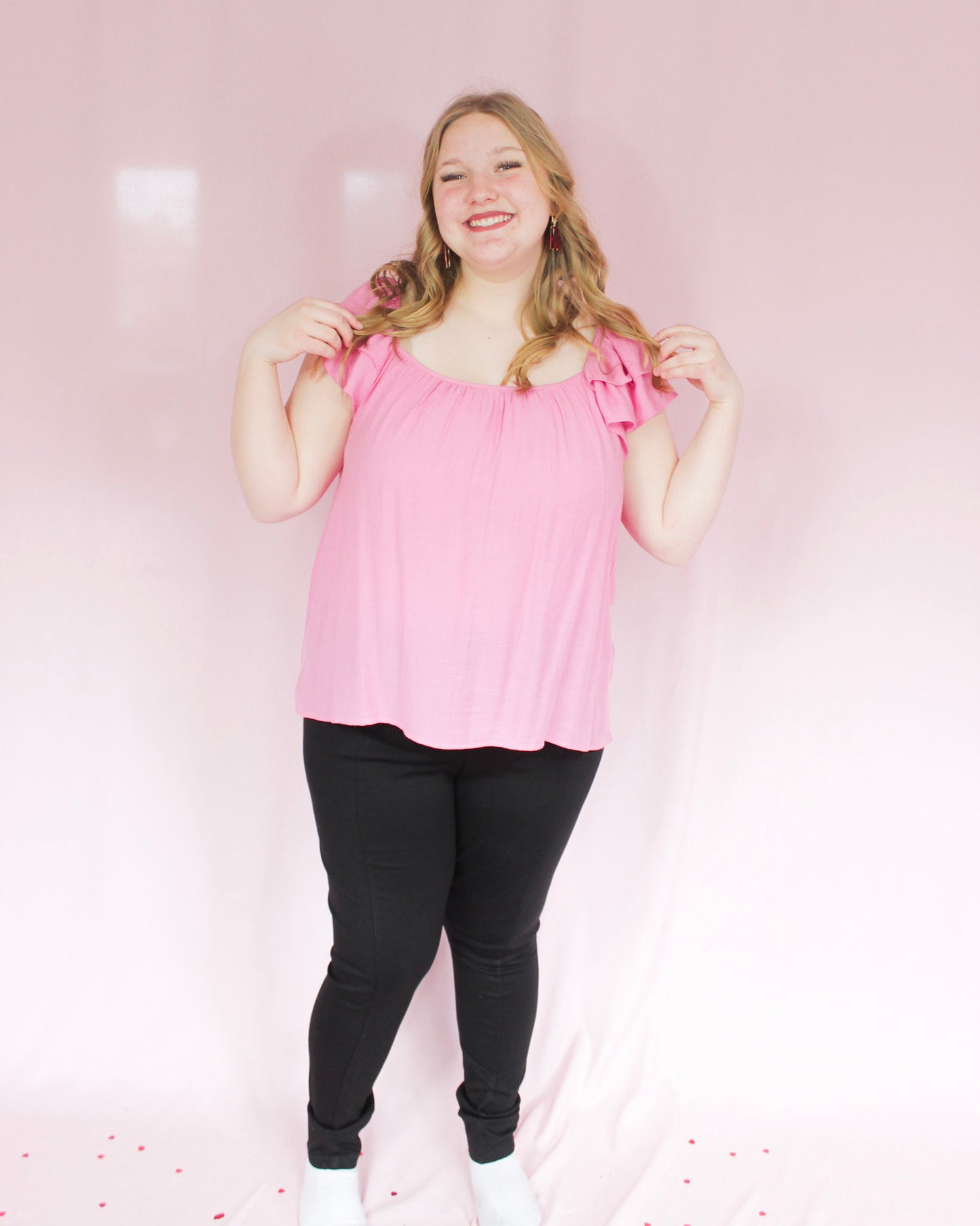 Bright pink blouse top with flutter sleeves and open back detail and tie on back with scoop neckline