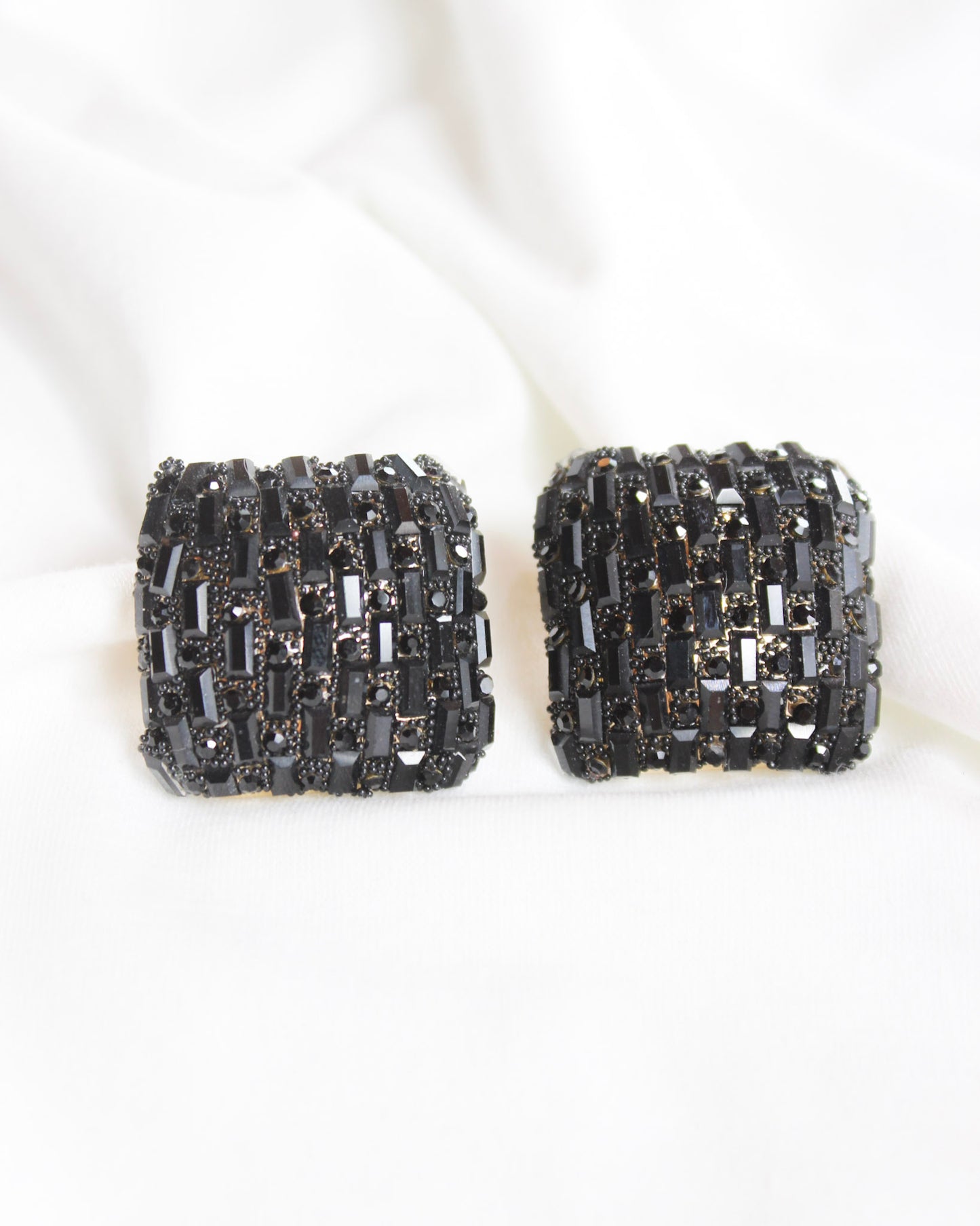 Square statement earrings with small black rectangle gems and gold accents