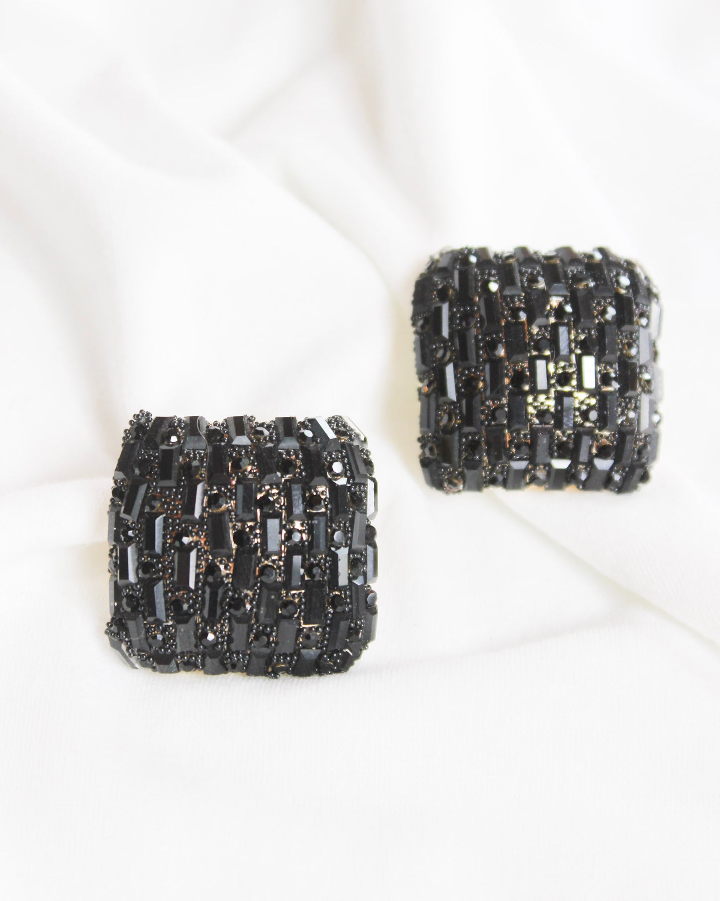 Square statement earrings with small black rectangle gems and gold accents