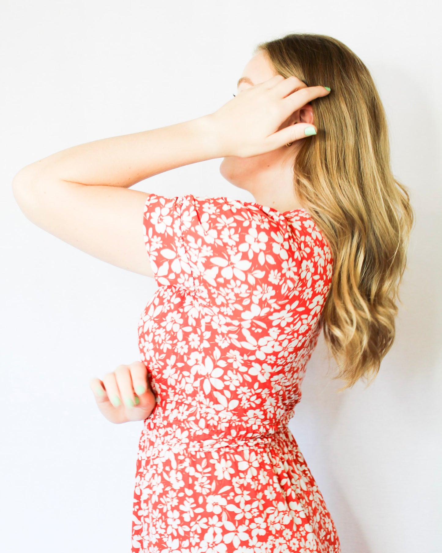 Bright red-orange with white floral midi length dress with subtle puff sleeves and v neckline