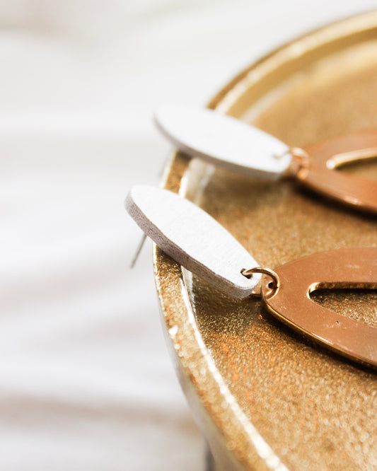 Dangle statement earrings with white oval into big gold imperfect oval 