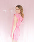 Bright pink romper with flutter sleeves and ruffle hem on the bottom - waistband - round neckline comfortable material 