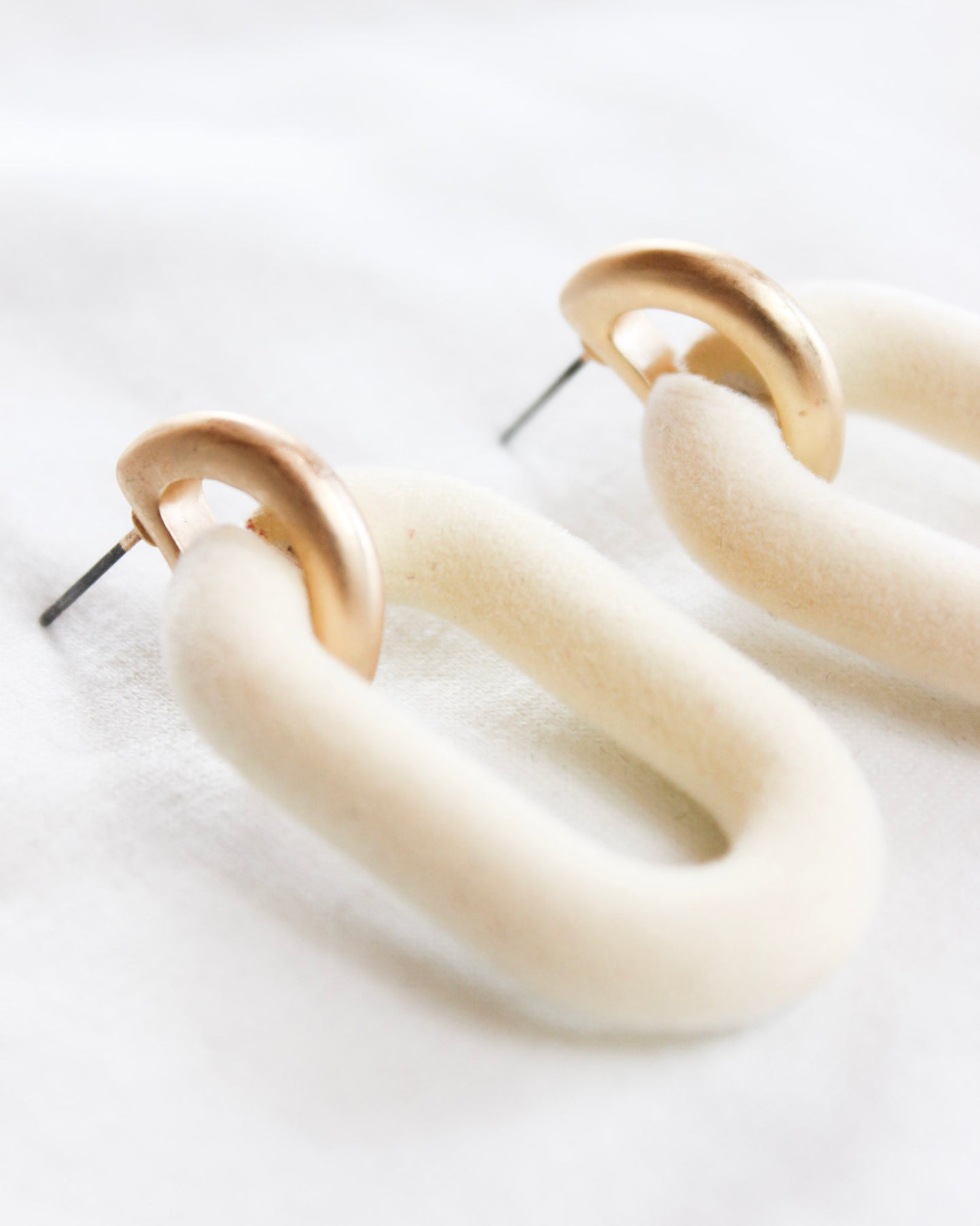 Cream velvet oval with gold hook