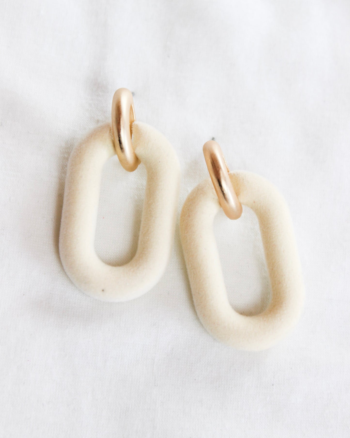 Cream velvet oval with gold hook