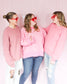 Bright pink thick sweater with ribbed hem round neck and raglan balloon sleeves paired with Judy Blue Jeans