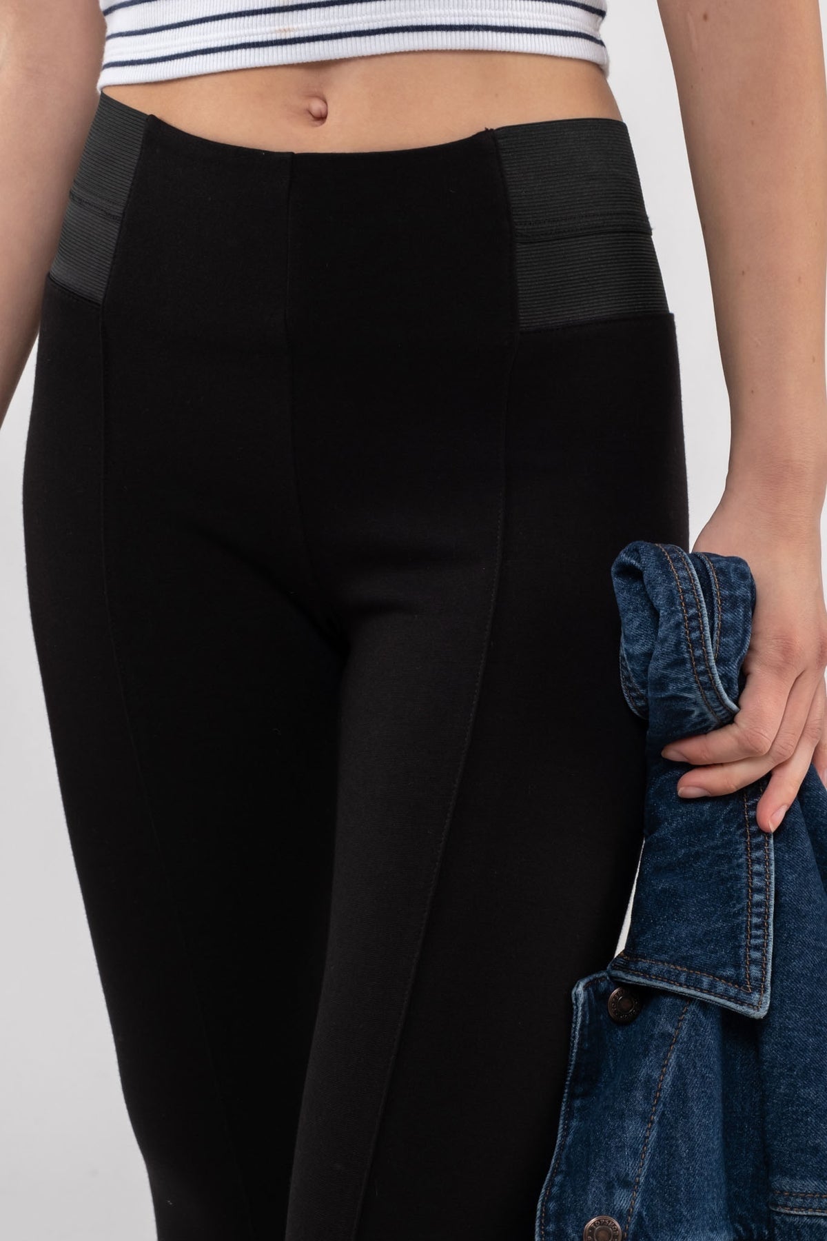 Elastic waistband black legging pants with seam line down the front of each leg